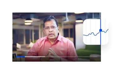 Video tutorial trading di aplikasi dengan instruktur yang bicara di samping ikon chart pasar saham.